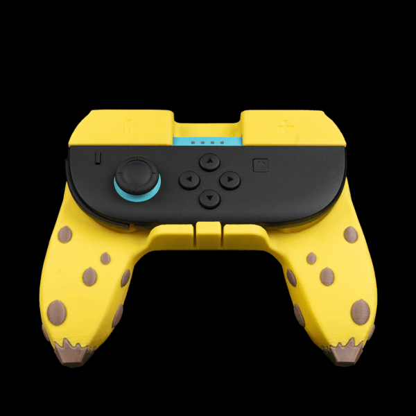 Mando de videojuego amarillo con diseño de manchas