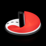 Objeto semicircular rojo y blanco sobre fondo negro